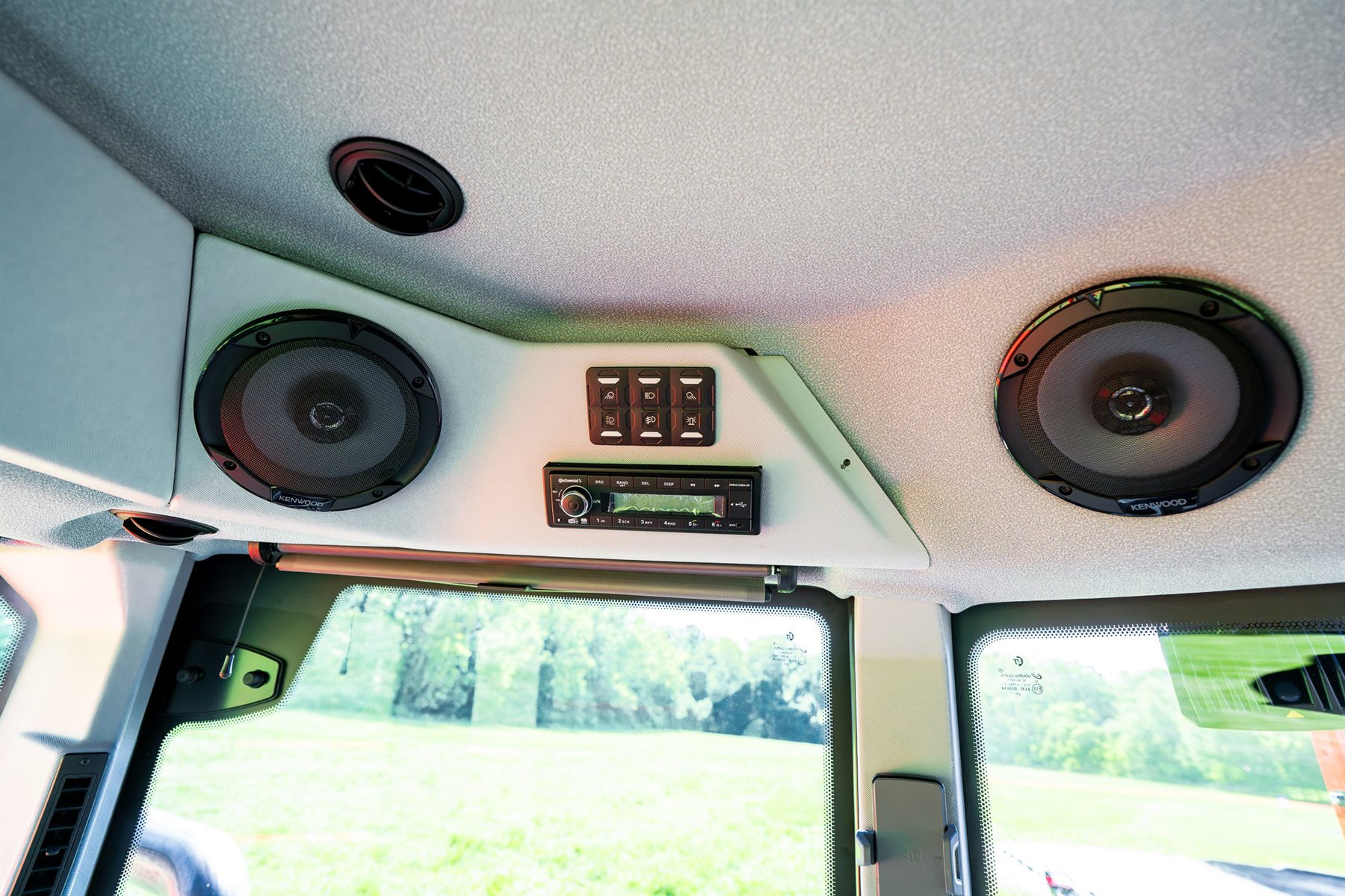 Overhead radio and speakers in the headliner