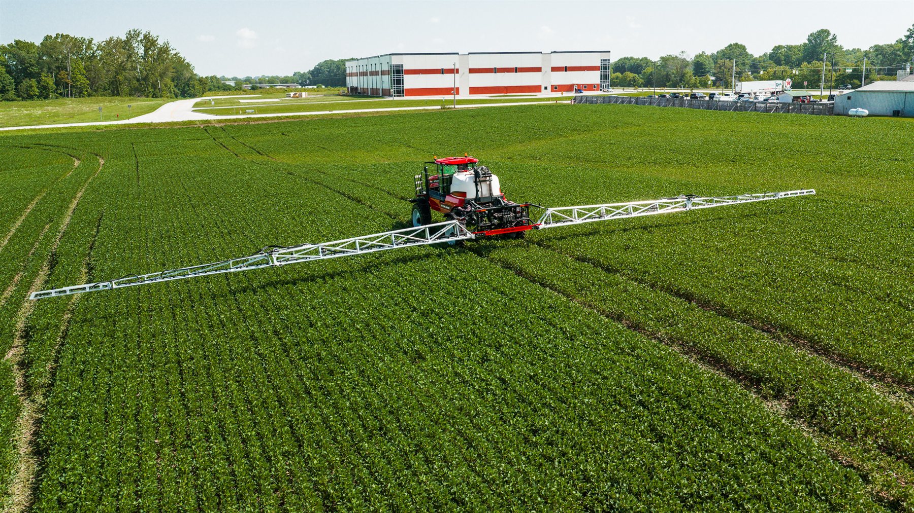 Apache HS1150 spraying, aerial view with booms extended